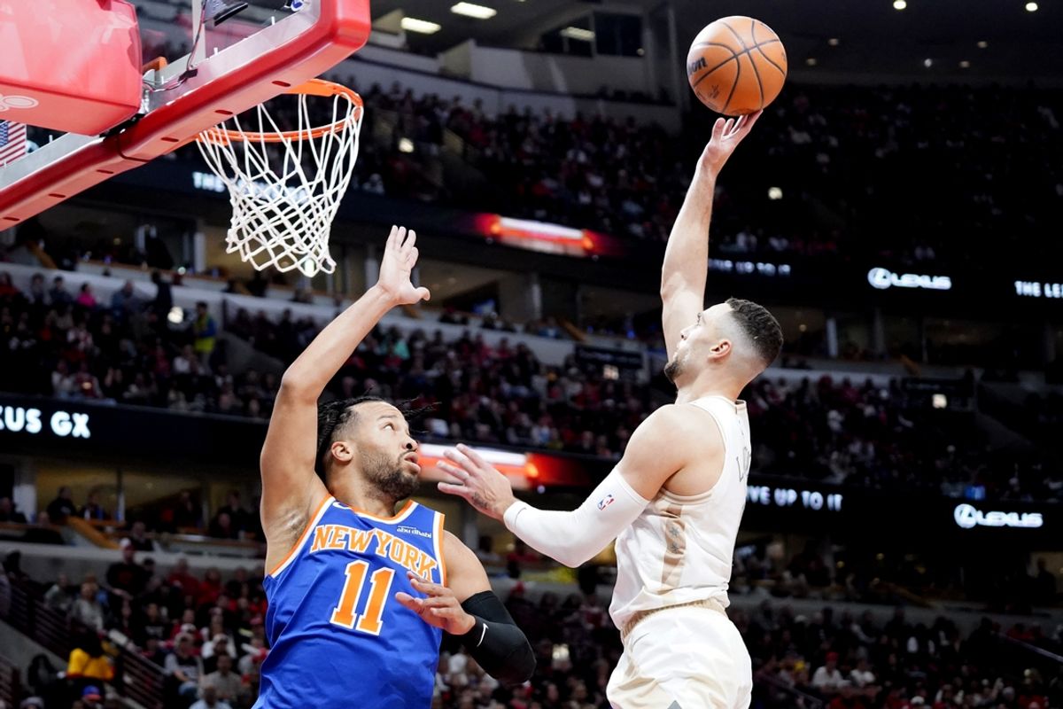Jan 4, 2025; Chicago, Illinois, USA; Chicago Bulls guard Zach LaVine (8) shoots the ball over New York Knicks guard Jalen Brunson (11) during the first quarter at United Center. Mandatory Credit: David Banks-Imagn Images