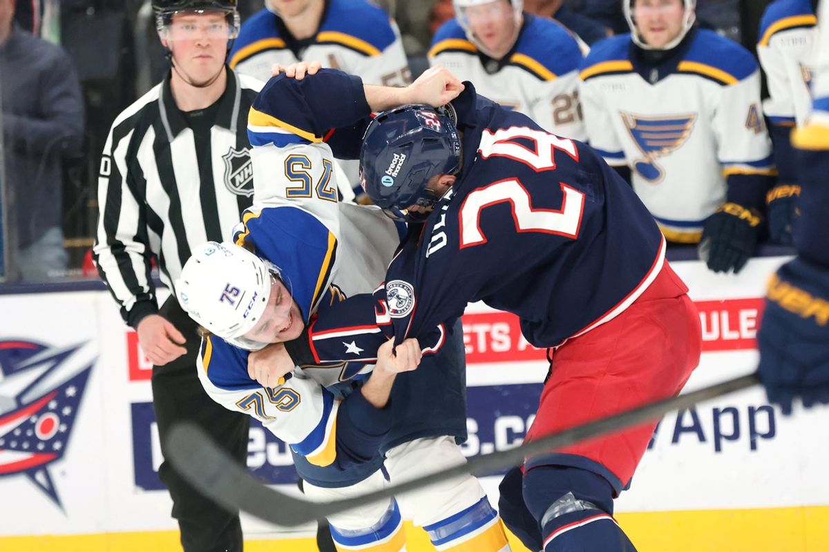 Jan 4, 2025; Columbus, Ohio, USA;  Columbus Blue Jackets right wing Mathieu Olivier (24) fights with St. Louis Blues defenseman Tyler Tucker (75) during the second period at Nationwide Arena. Mandatory Credit: Joseph Maiorana-Imagn Images