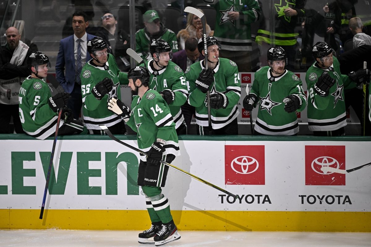 Jan 4, 2025; Dallas, Texas, USA; Dallas Stars left wing Jamie Benn (14) skates past the Stars team bench after he scores a goal against the Utah Hockey Club during the second period at the American Airlines Center. Mandatory Credit: Jerome Miron-Imagn Images