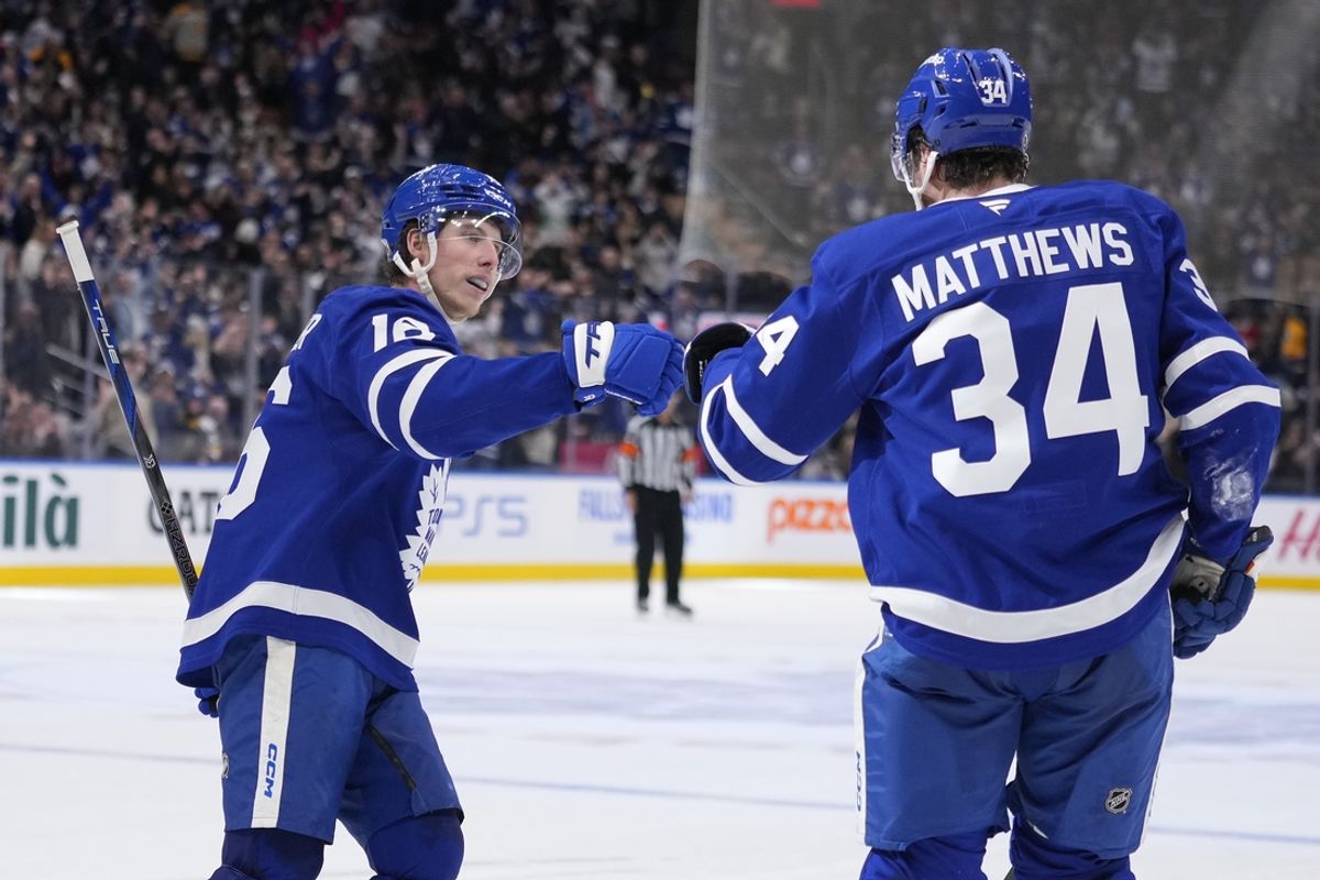 Jan 4, 2025; Toronto, Ontario, CAN; Toronto Maple Leafs forward Mitch Marner (16) congratulate Toronto Maple Leafs forward Auston Matthews (34) after his goal against the Boston Bruins during the third period at Scotiabank Arena. Mandatory Credit: John E. Sokolowski-Imagn Images