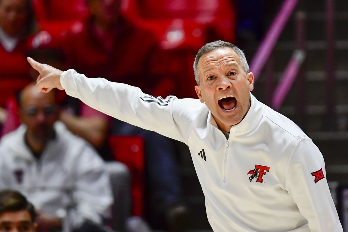 Jan 4, 2025; Salt Lake City, Utah, USA; Texas Tech Red Raiders head coach Grant McCasland makes a call during the second half against the Utah Utes at the Jon M. Huntsman Center. Mandatory Credit: Christopher Creveling-Imagn Images