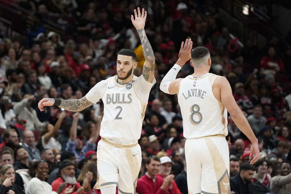 Jan 4, 2025; Chicago, Illinois, USA; Chicago Bulls guard Lonzo Ball (2) high fives guard Zach LaVine (8) after making a three point basket against the New York Knicks during the second half at United Center. Mandatory Credit: David Banks-Imagn Images
