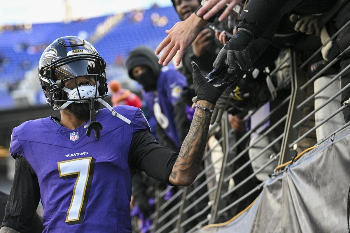 Jan 4, 2025; Baltimore, Maryland, USA;  Baltimore Ravens wide receiver Rashod Bateman (7) high fives fast before the game against the Cleveland Browns at M&T Bank Stadium. Mandatory Credit: Tommy Gilligan-Imagn Images
