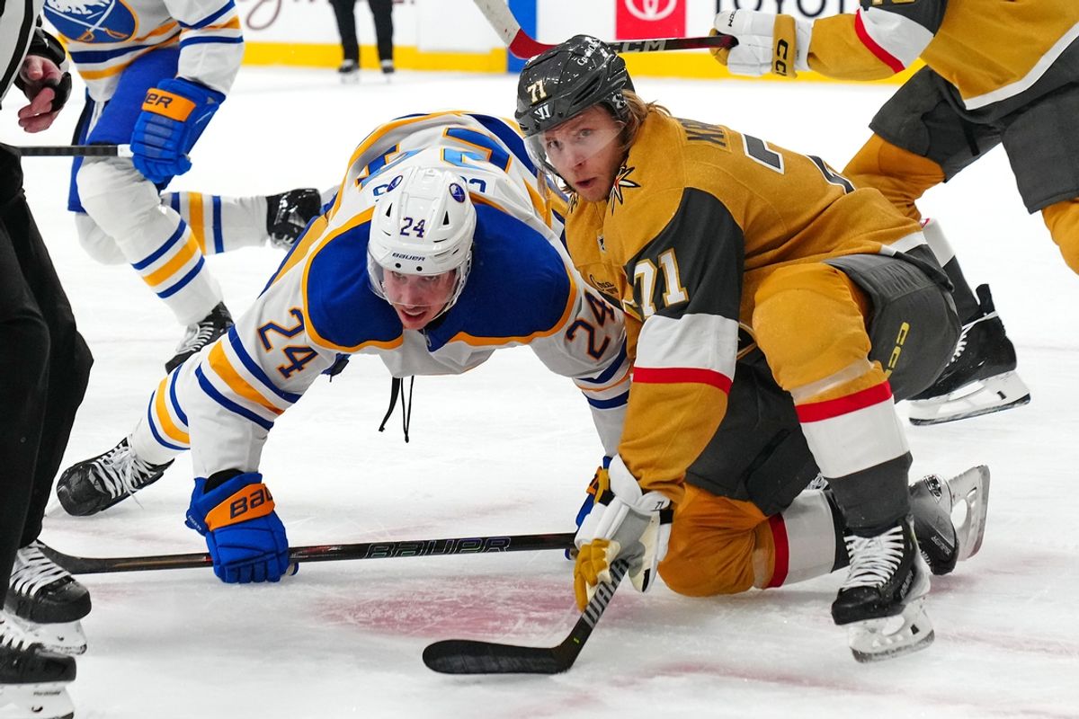 Jan 4, 2025; Las Vegas, Nevada, USA; Buffalo Sabres center Dylan Cozens (24) and Vegas Golden Knights center William Karlsson (71) watch the puck after a face off during the first period at T-Mobile Arena. Mandatory Credit: Stephen R. Sylvanie-Imagn Images