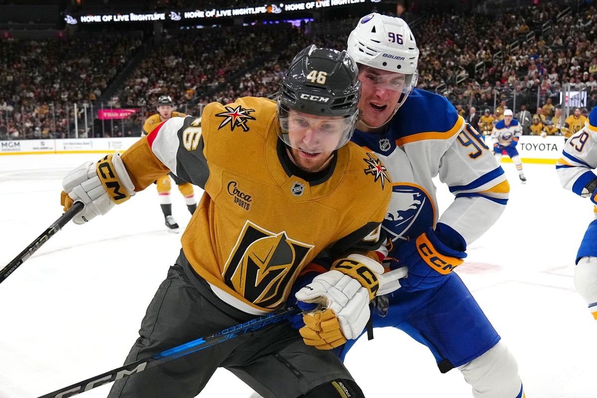 Jan 4, 2025; Las Vegas, Nevada, USA; Vegas Golden Knights right wing Jonas Rondbjerg (46) and Buffalo Sabres right wing Nicolas Aube-Kubel (96) vie for the puck during the second period at T-Mobile Arena. Mandatory Credit: Stephen R. Sylvanie-Imagn Images