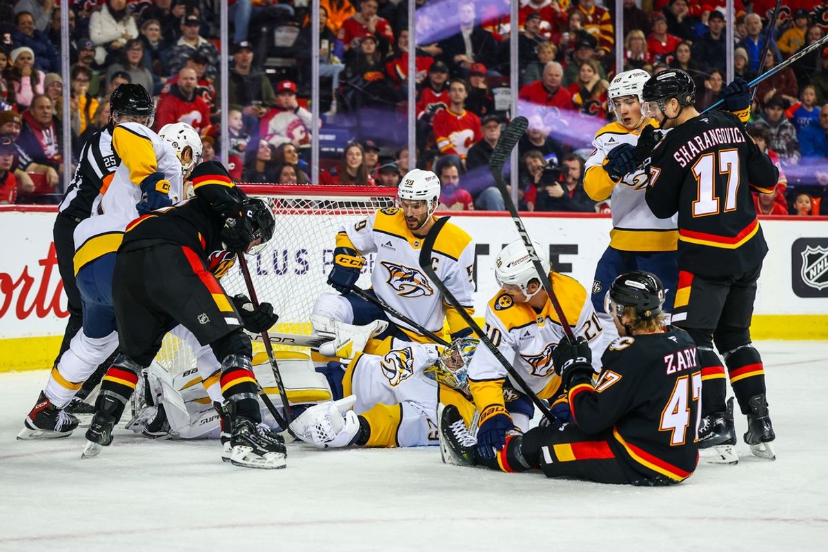 Jan 4, 2025; Calgary, Alberta, CAN; Nashville Predators goaltender Justus Annunen (29) makes a save against the Calgary Flames during the second period at Scotiabank Saddledome. Mandatory Credit: Sergei Belski-Imagn Images