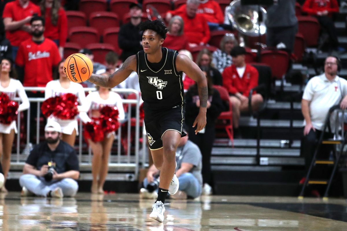 Dec 31, 2024; Lubbock, Texas, USA;  Central Florida Knights guard Jordan Ivy-Curry (0) dribbles the ball against the Texas Tech Red Raiders in the first half at United Supermarkets Arena. Mandatory Credit: Michael C. Johnson-Imagn Images