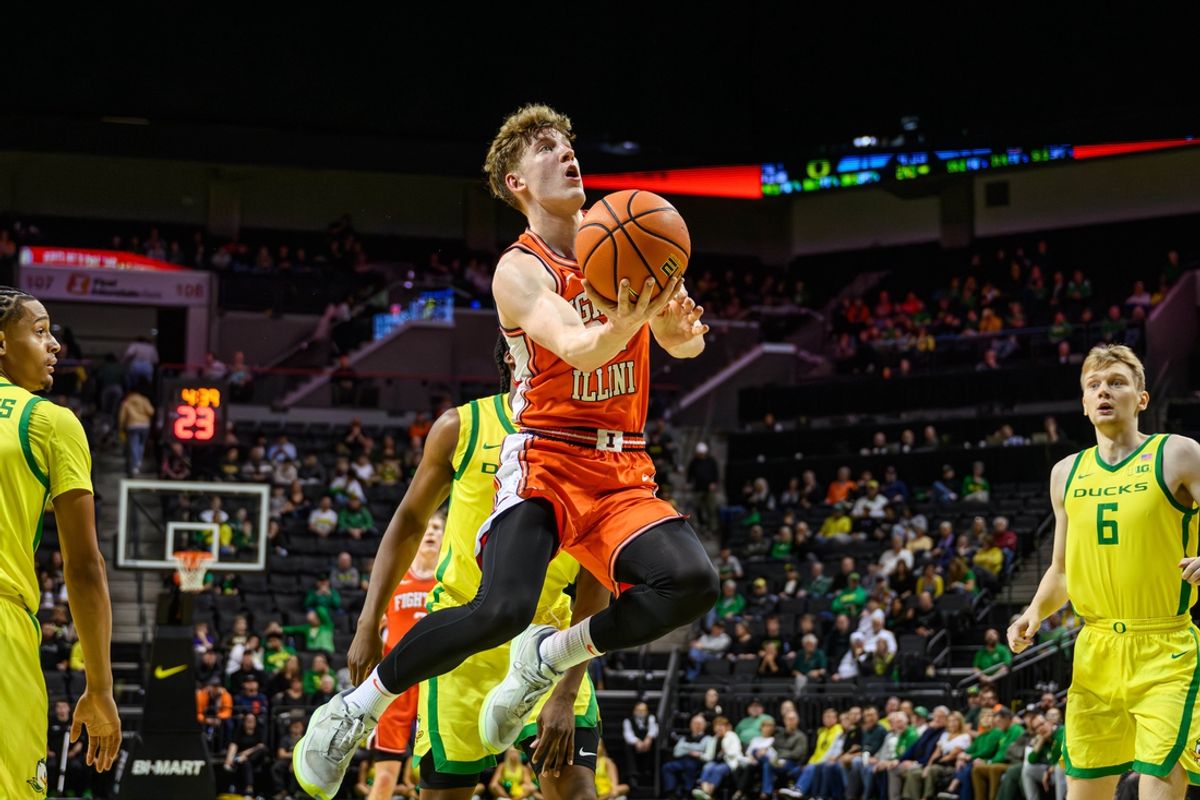 Jan 2, 2025; Eugene, Oregon, USA; Illinois Fighting Illini guard Kasparas Jakucionis (32) drives to the basket during the second half against the Oregon Ducks at Matthew Knight Arena. Mandatory Credit: Craig Strobeck-Imagn Images