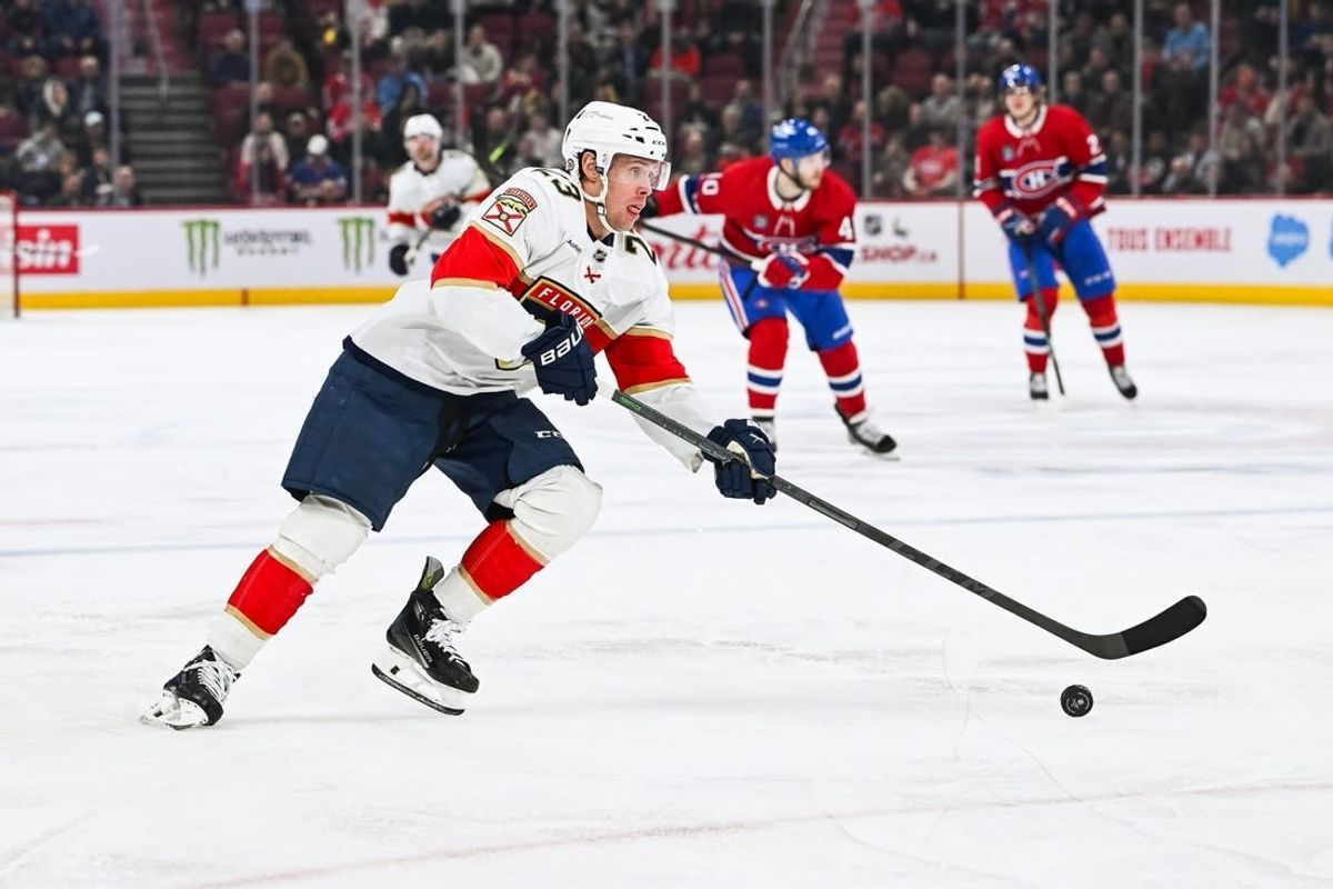 Nov 30, 2023; Montreal, Quebec, CAN; Florida Panthers center Carter Verhaeghe (23) plays the puck against the Montreal Canadiens during the second period at Bell Centre.