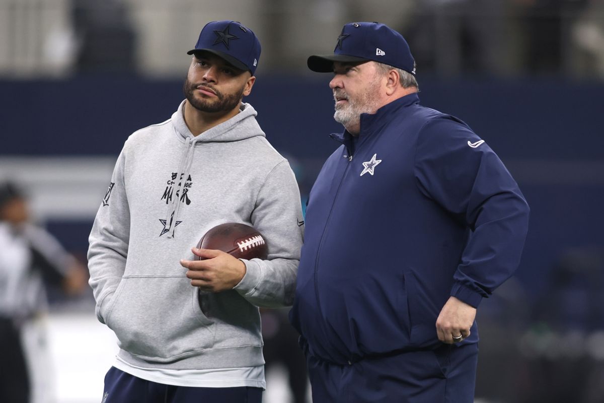 Jan 5, 2025; Arlington, Texas, USA; Dallas Cowboys quarterback Dak Prescott (4) talks to head coach Mike McCarthy before the game against the Washington Commanders at AT&T Stadium. Mandatory Credit: Tim Heitman-Imagn Images