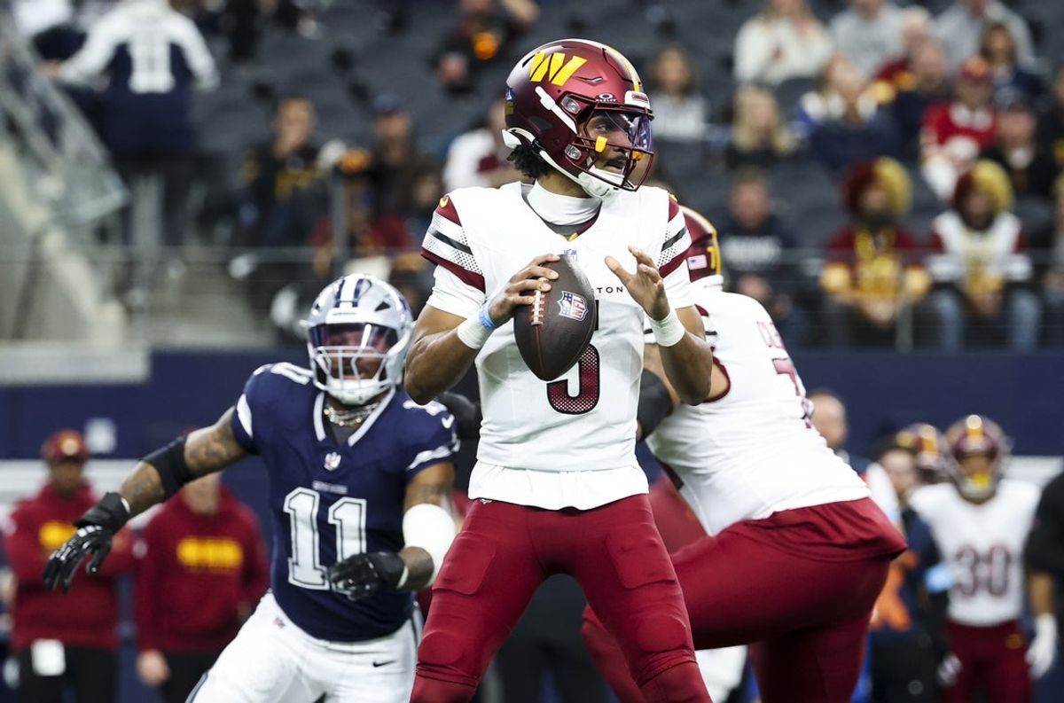 Washington Commanders quarterback Jayden Daniels was sacked 4.5 times by former Dallas Cowboys linebacker Micah Parsons (11), who was traded to the Packers. Mandatory Credit: Kevin Jairaj-Imagn Images