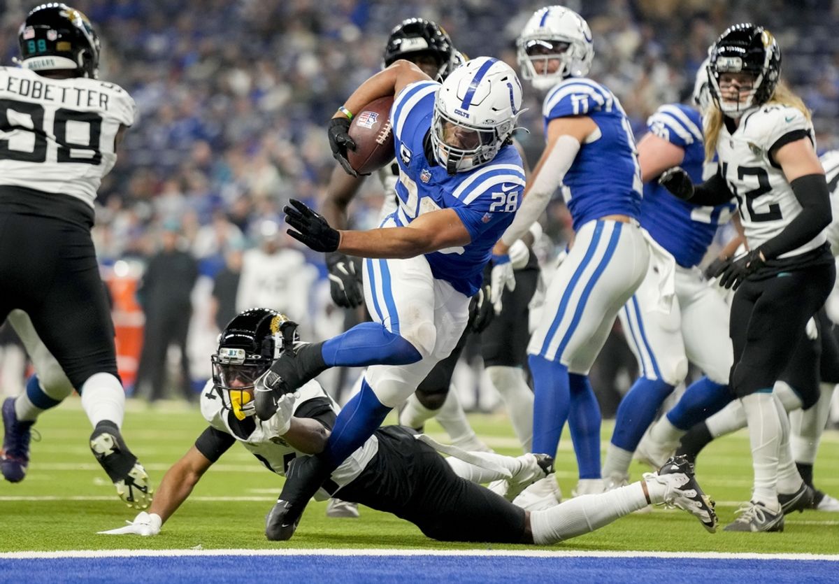 Jan 5, 2025; Indianapolis, Indiana, USA; Indianapolis Colts running back Jonathan Taylor (28) rushes for a touchdown during a game against the Jacksonville Jaguar at Lucas Oil Stadium. Mandatory Credit: Grace Hollars/USA TODAY Network via Imagn Images