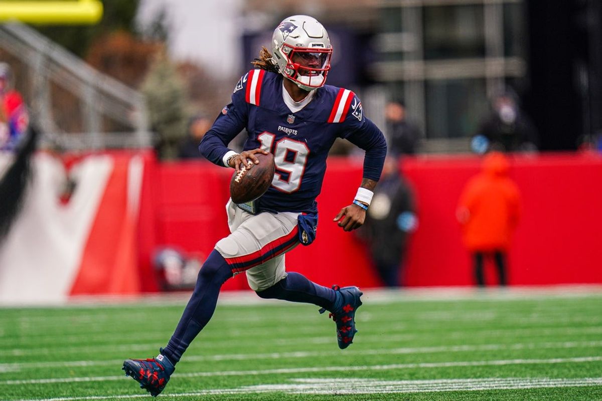 Jan 5, 2025; Foxborough, Massachusetts, USA; New England Patriots quarterback Joe Milton III (19) runs the ball against the Buffalo Bills in the first half at Gillette Stadium. Mandatory Credit: David Butler II-Imagn Images
