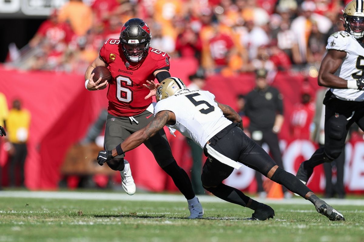 Jan 5, 2025; Tampa, Florida, USA; Tampa Bay Buccaneers quarterback Baker Mayfield (6) runs with the ball against the New Orleans Saints in the second quarter  at Raymond James Stadium. Mandatory Credit: Nathan Ray Seebeck-Imagn Images