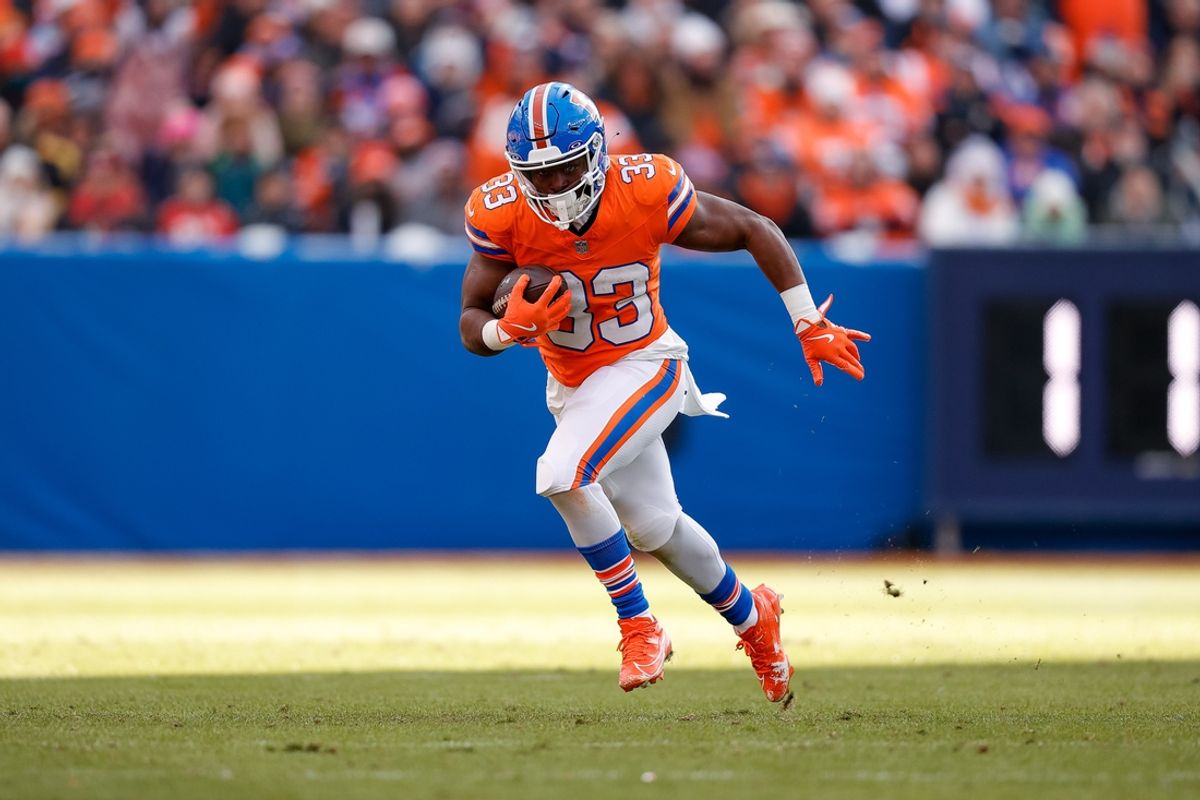 Jan 5, 2025; Denver, Colorado, USA; Denver Broncos running back Javonte Williams (33) runs the ball in the second quarter against the Kansas City Chiefs at Empower Field at Mile High. Mandatory Credit: Isaiah J. Downing-Imagn Images
