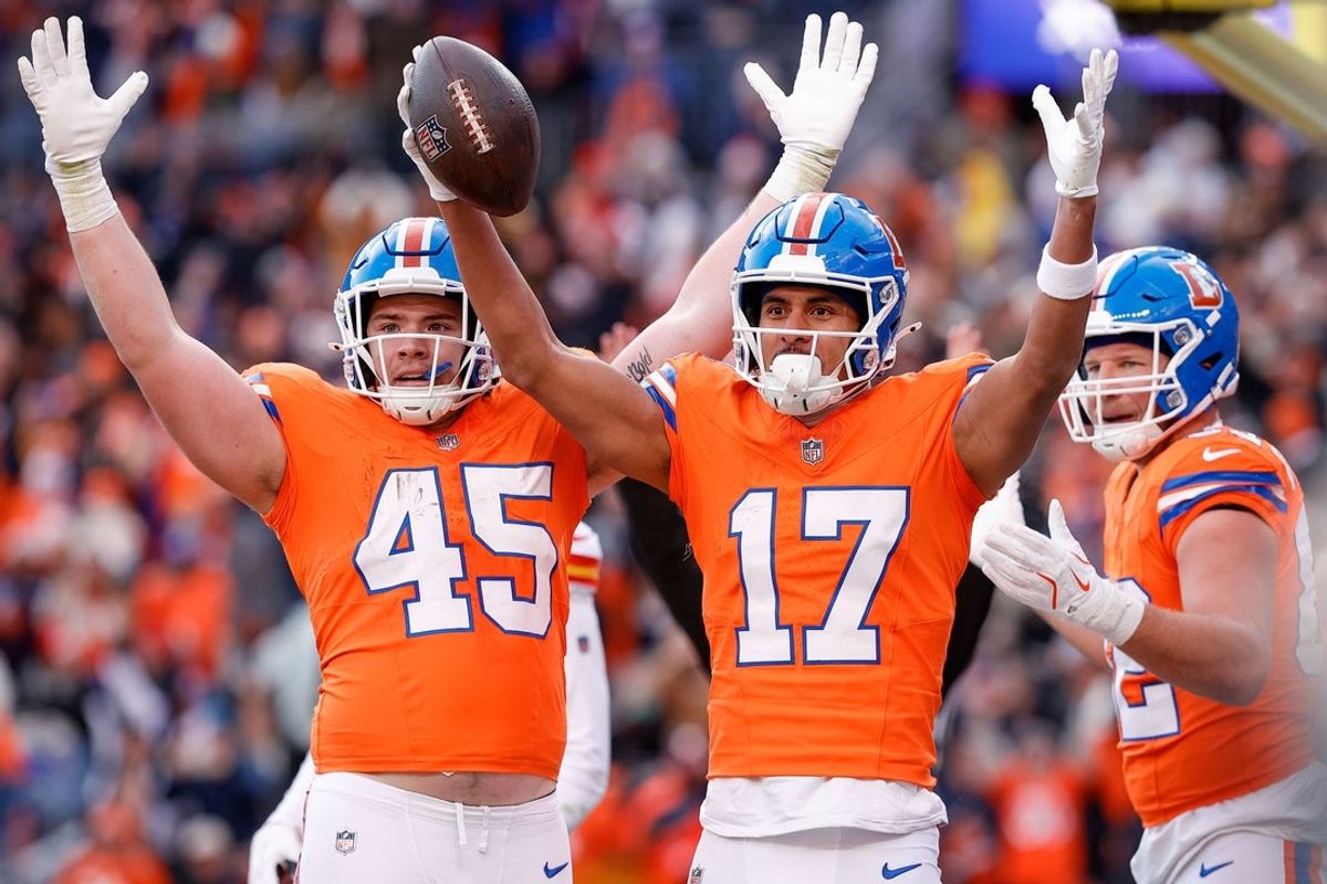 Jan 5, 2025; Denver, Colorado, USA; Denver Broncos wide receiver Devaughn Vele (17) celebrates  his touchdown with tight end Nate Adkins (45) and tight end Adam Trautman (82) in the second quarter against the Kansas City Chiefs at Empower Field at Mile High. Mandatory Credit: Isaiah J. Downing-Imagn Images