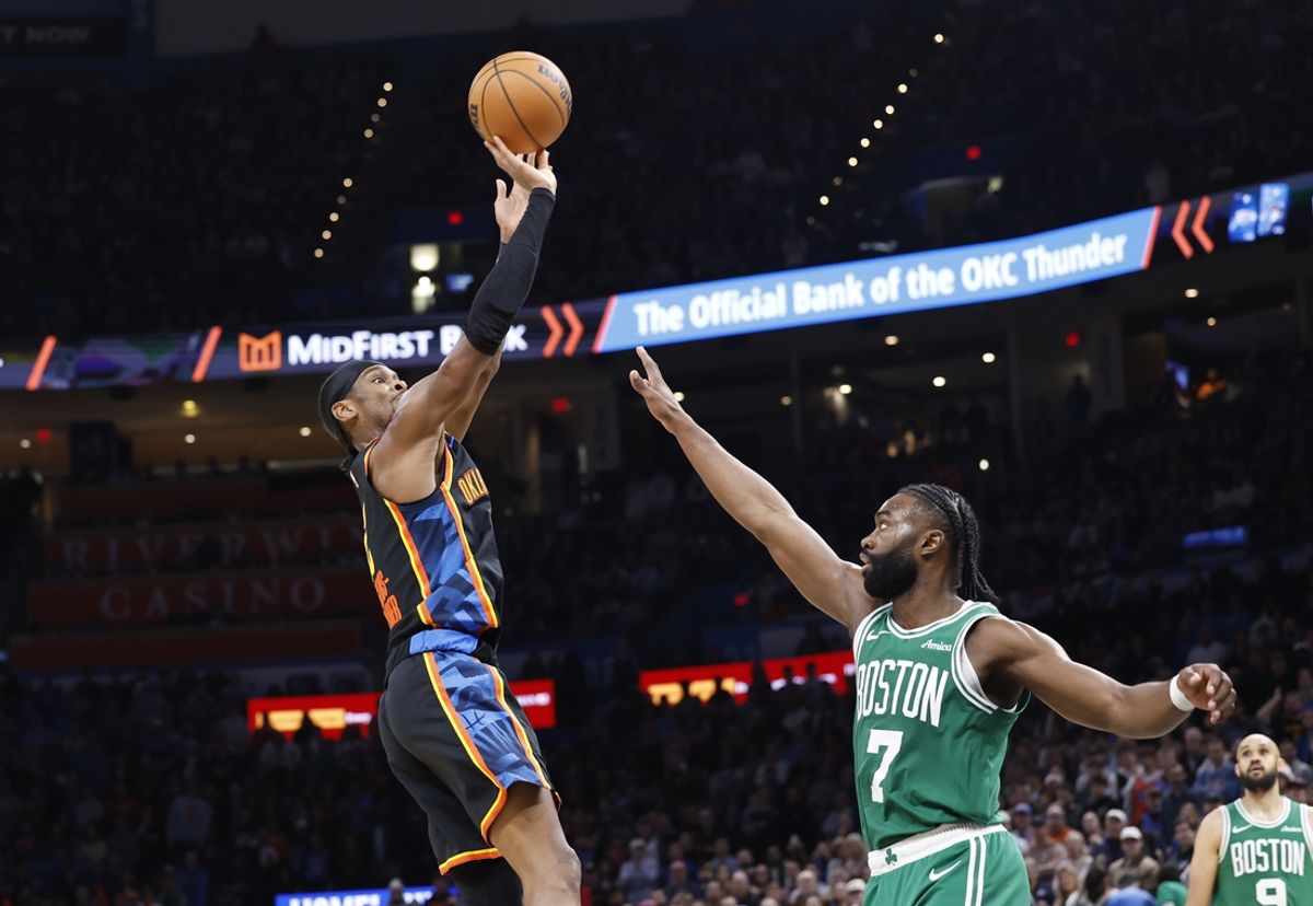 Jan 5, 2025; Oklahoma City, Oklahoma, USA; Oklahoma City Thunder guard Shai Gilgeous-Alexander (2) shoots the ball over Boston Celtics guard Jaylen Brown (7) during the fourth quarter at Paycom Center. Mandatory Credit: Alonzo Adams-Imagn Images