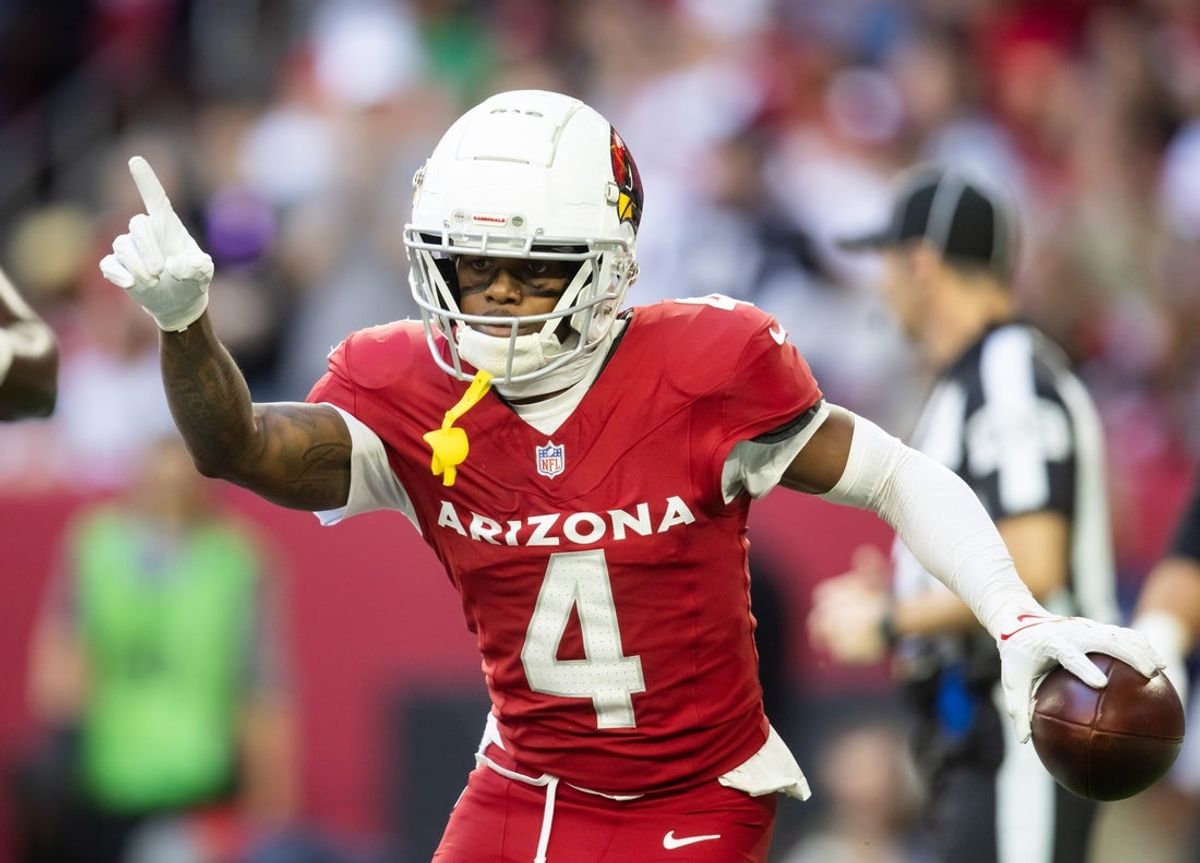 Jan 5, 2025; Glendale, Arizona, USA; Arizona Cardinals wide receiver Greg Dortch (4) celebrates after scoring a touchdown against the San Francisco 49ers in the first half at State Farm Stadium. Mandatory Credit: Mark J. Rebilas-Imagn Images