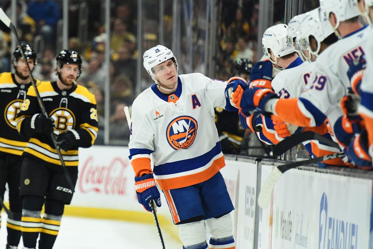 Jan 5, 2025; Boston, Massachusetts, USA; New York Islanders center Bo Horvat (14) is congratulated by his teammates after scoring a goal during the first period against the Boston Bruins at TD Garden. Mandatory Credit: Bob DeChiara-Imagn Images