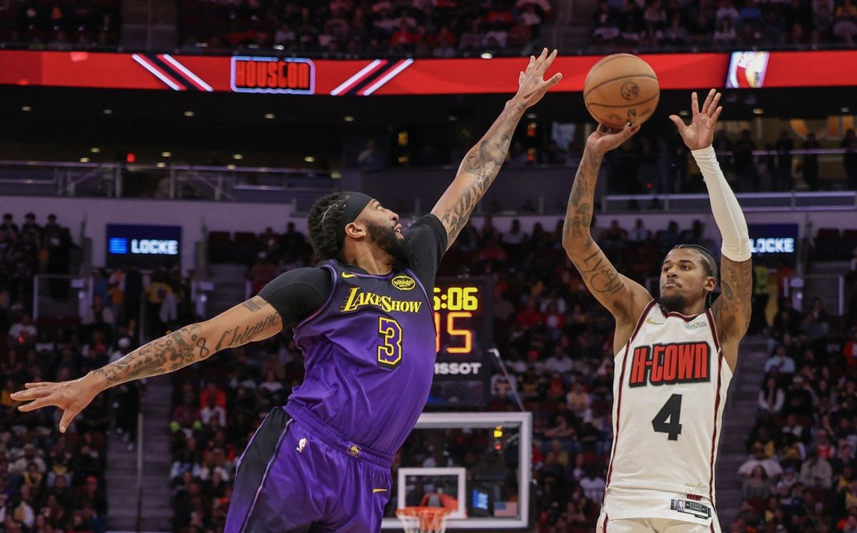 Jan 5, 2025; Houston, Texas, USA;  Houston Rockets guard Jalen Green (4) shoots against Los Angeles Lakers forward Anthony Davis (3) in the first quarter at Toyota Center. Mandatory Credit: Thomas Shea-Imagn Images