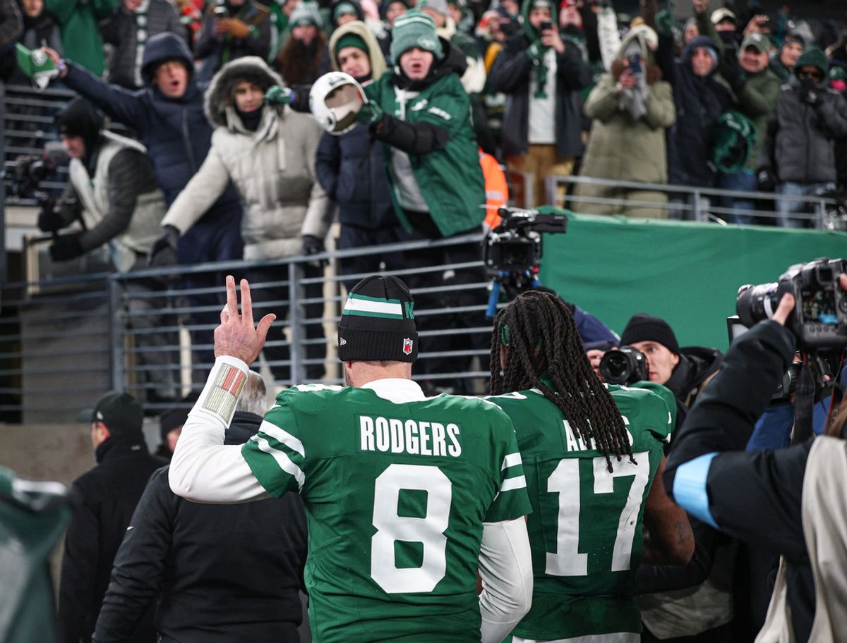 Jan 5, 2025; East Rutherford, New Jersey, USA; New York Jets quarterback Aaron Rodgers (8) walks off the field with wide receiver Davante Adams (17) after the game against the Miami Dolphins at MetLife Stadium. Mandatory Credit: Vincent Carchietta-Imagn Images