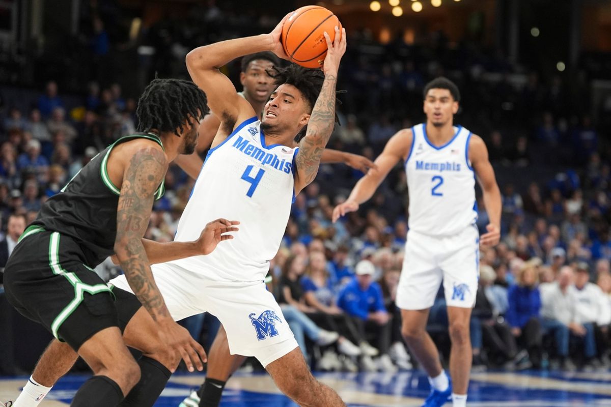 Memphis' PJ Haggerty (4) drives to the basket during the game between the University of North Texas and the University of Memphis at FedExForum in Memphis, Tenn., on Sunday, January 5, 2025.