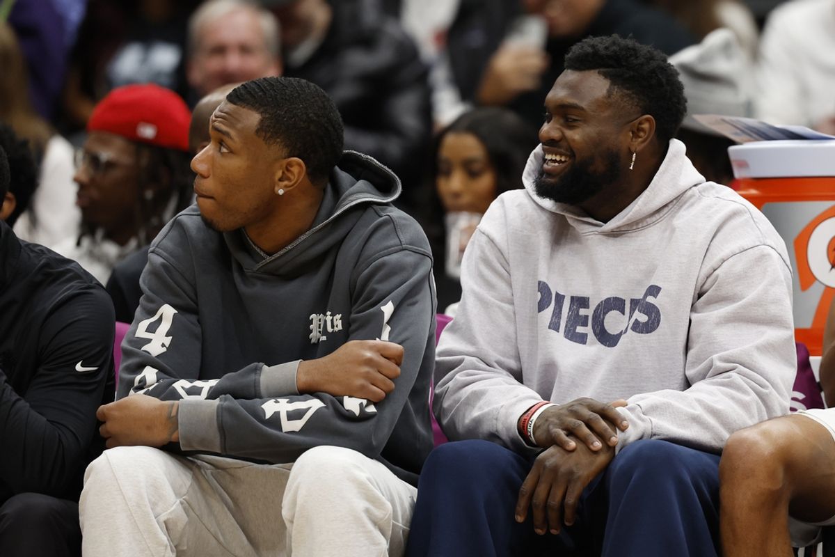 Jan 5, 2025; Washington, District of Columbia, USA; Injured New Orleans Pelicans forward Zion Williamson (R) looks on from the bench against the Washington Wizards in the second quarter at Capital One Arena. Mandatory Credit: Geoff Burke-Imagn Images
