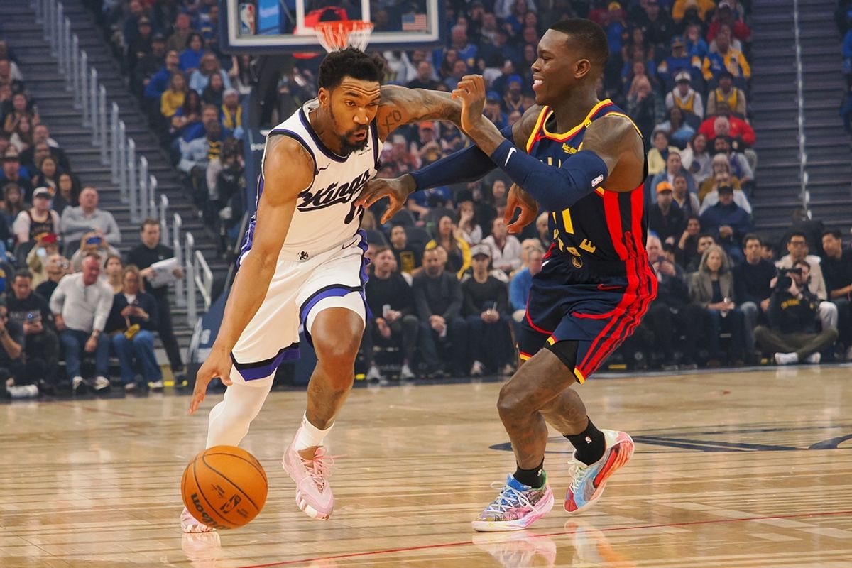 Jan 5, 2025; San Francisco, California, USA; Sacramento Kings guard Malik Monk (0) drives in against Golden State Warriors guard Dennis Schroder (71) during the first quarter at Chase Center. Mandatory Credit: Kelley L Cox-Imagn Images
