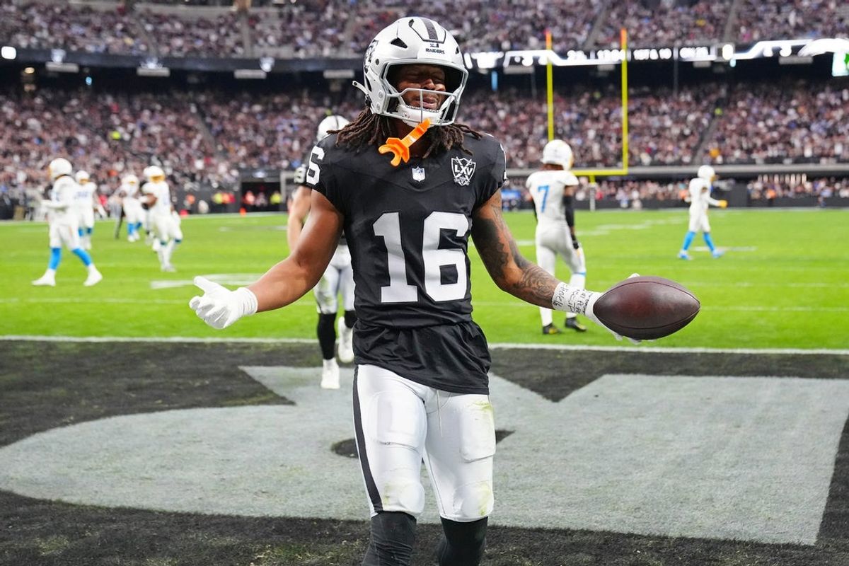 Jan 5, 2025; Paradise, Nevada, USA; Las Vegas Raiders wide receiver Jakobi Meyers (16) celebrates after scoring a touchdown against the Los Angeles Chargers during the second quarter at Allegiant Stadium. Mandatory Credit: Stephen R. Sylvanie-Imagn Images