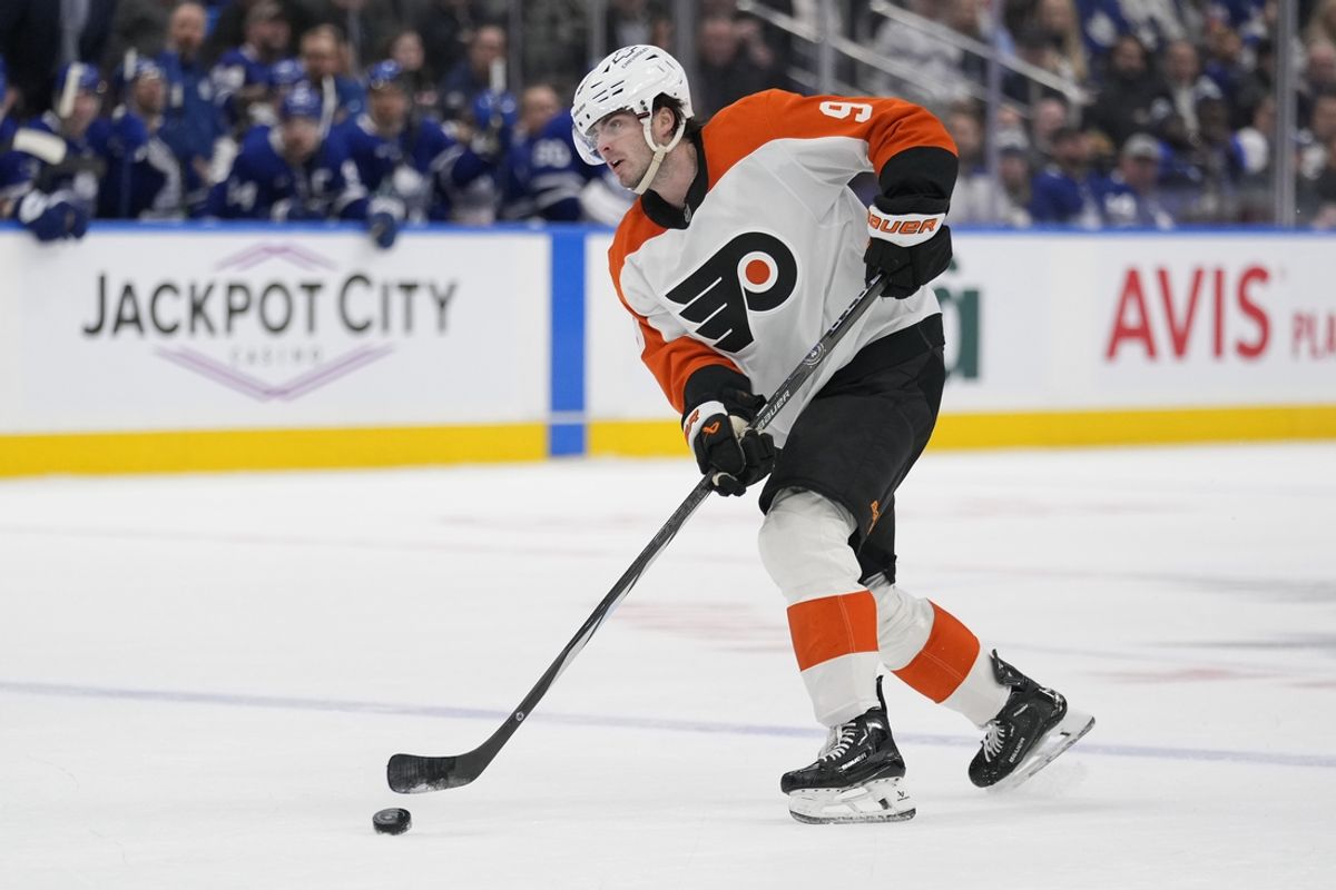 Jan 5, 2025; Toronto, Ontario, CAN; Philadelphia Flyers defenceman Jamie Drysdale (9) shoots the puck against the Toronto Maple Leafs during the second period at Scotiabank Arena. Mandatory Credit: John E. Sokolowski-Imagn Images