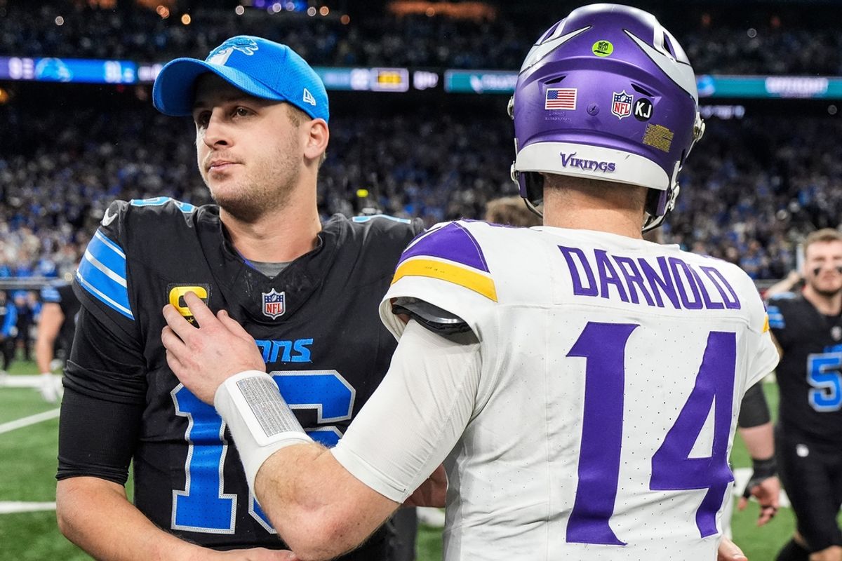 Detroit Lions quarterback Jared Goff (16) hugs Minnesota Vikings quarterback Sam Darnold (14) after 31-9 win at Ford Field in Detroit on Sunday, Jan. 5, 2025.