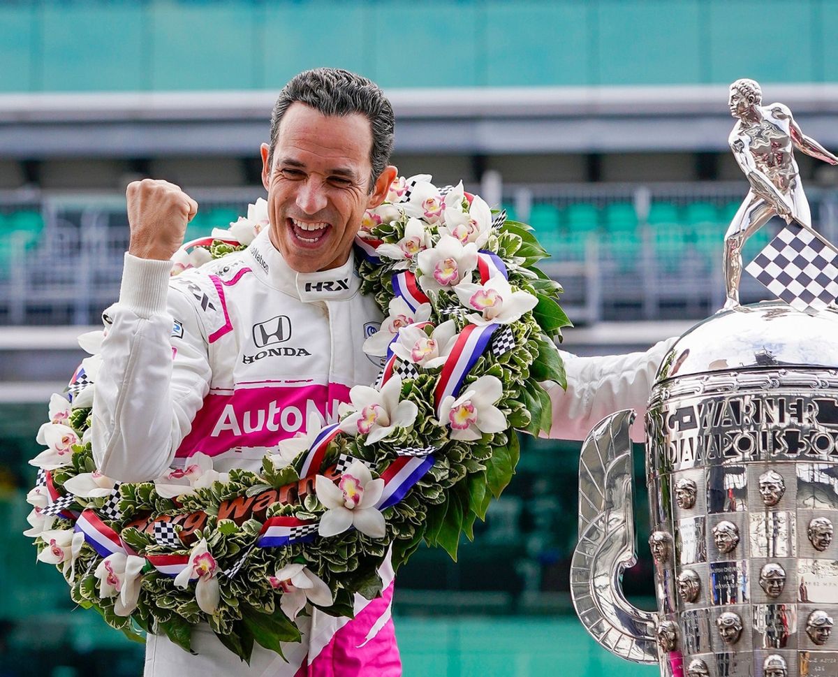 Helio Castroneves celebrates winning the105th Indianapolis 500 on May 31, 2021, tying the record for most wins in Indy 500 history.