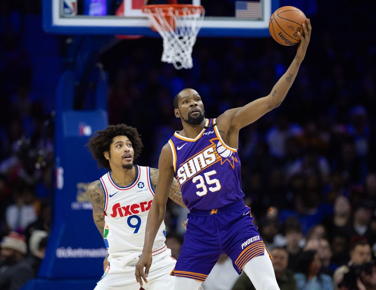 Jan 6, 2025; Philadelphia, Pennsylvania, USA; Phoenix Suns forward Kevin Durant (35) controls the ball in front of Philadelphia 76ers guard Kelly Oubre Jr. (9) during the second quarter at Wells Fargo Center. Mandatory Credit: Bill Streicher-Imagn Images