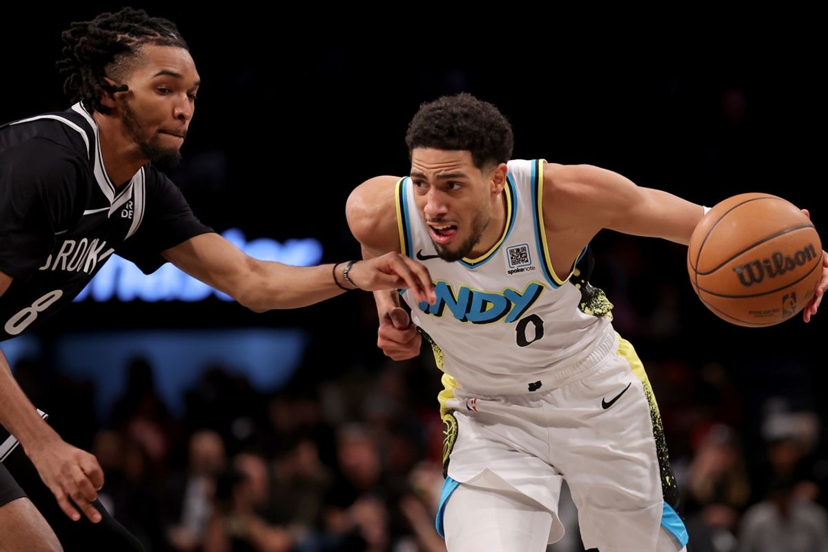 Jan 6, 2025; Brooklyn, New York, USA; Indiana Pacers guard Tyrese Haliburton (0) controls the ball against Brooklyn Nets forward Ziaire Williams (8) during the second quarter at Barclays Center. Mandatory Credit: Brad Penner-Imagn Images