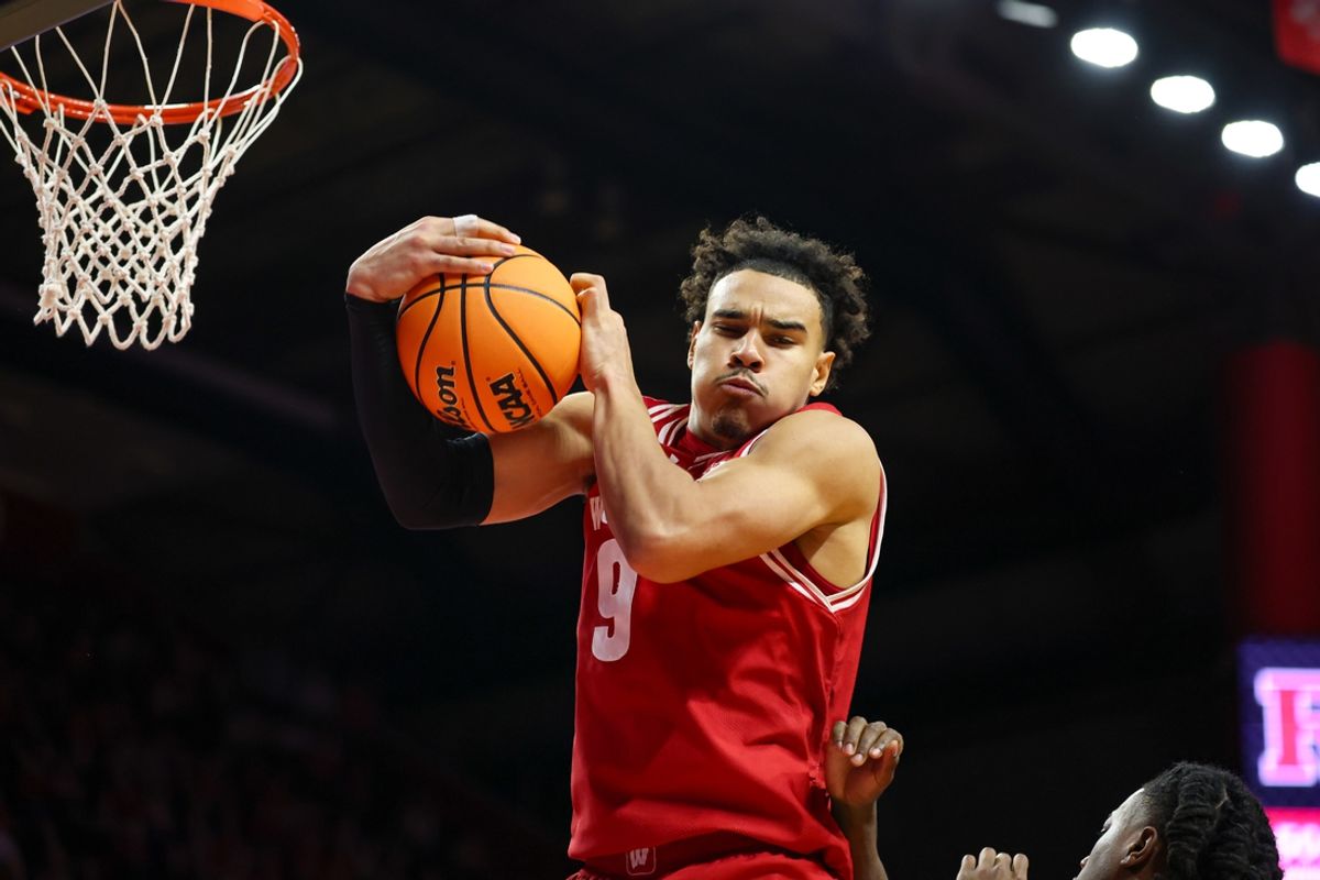 Jan 6, 2025; Piscataway, New Jersey, USA; Wisconsin Badgers guard John Tonje (9) rebounds during the second half against the Rutgers Scarlet Knights at Jersey Mike's Arena. Mandatory Credit: Vincent Carchietta-Imagn Images