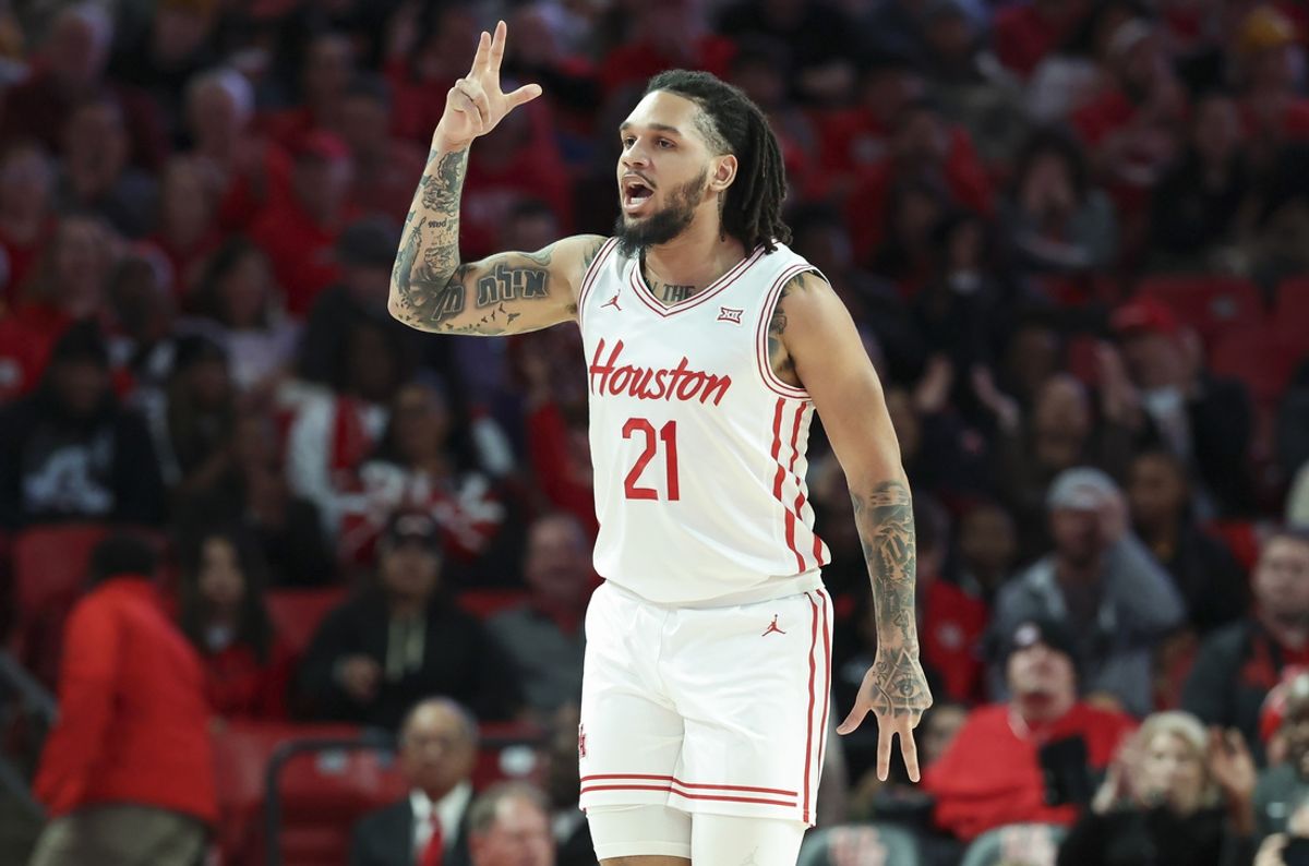 Jan 6, 2025; Houston, Texas, USA; Houston Cougars guard Emanuel Sharp (21) reacts after making a basket during the first half against the TCU Horned Frogs at Fertitta Center. Mandatory Credit: Troy Taormina-Imagn Images