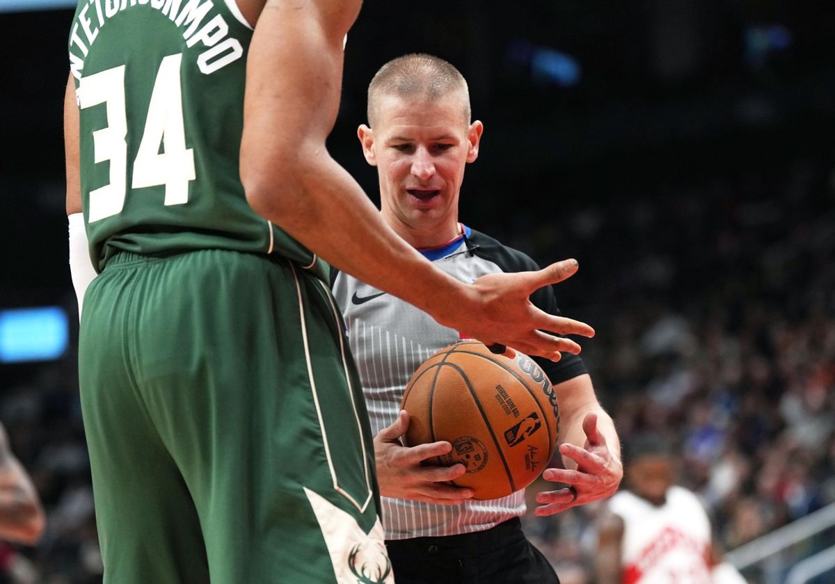 Jan 6, 2025; Toronto, Ontario, CAN; The NBA referee looks at Milwaukee Bucks forward Giannis Antetokounmpo (34) taped up finger against the Toronto Raptors during the third quarter at Scotiabank Arena. Mandatory Credit: Nick Turchiaro-Imagn Images