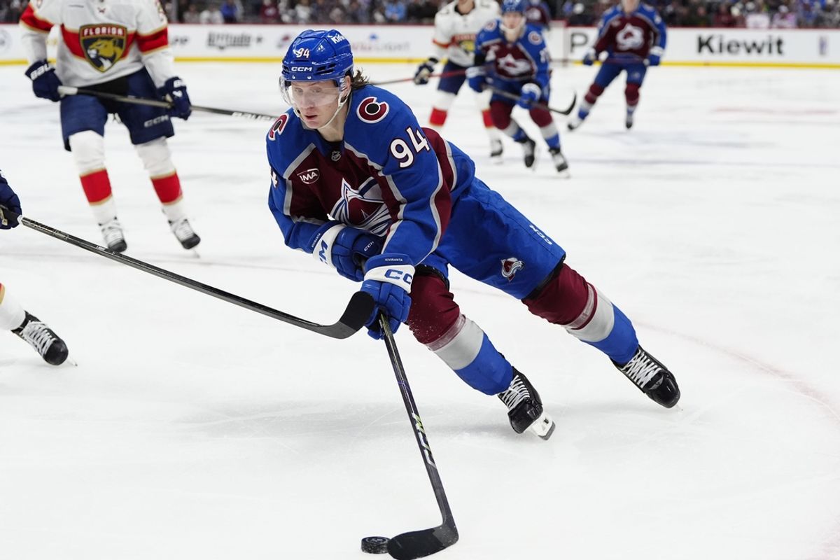 Jan 6, 2025; Denver, Colorado, USA; Colorado Avalanche left wing Joel Kiviranta (94) controls the puck in the second period against the Florida Panthers at Ball Arena. Mandatory Credit: Ron Chenoy-Imagn Images