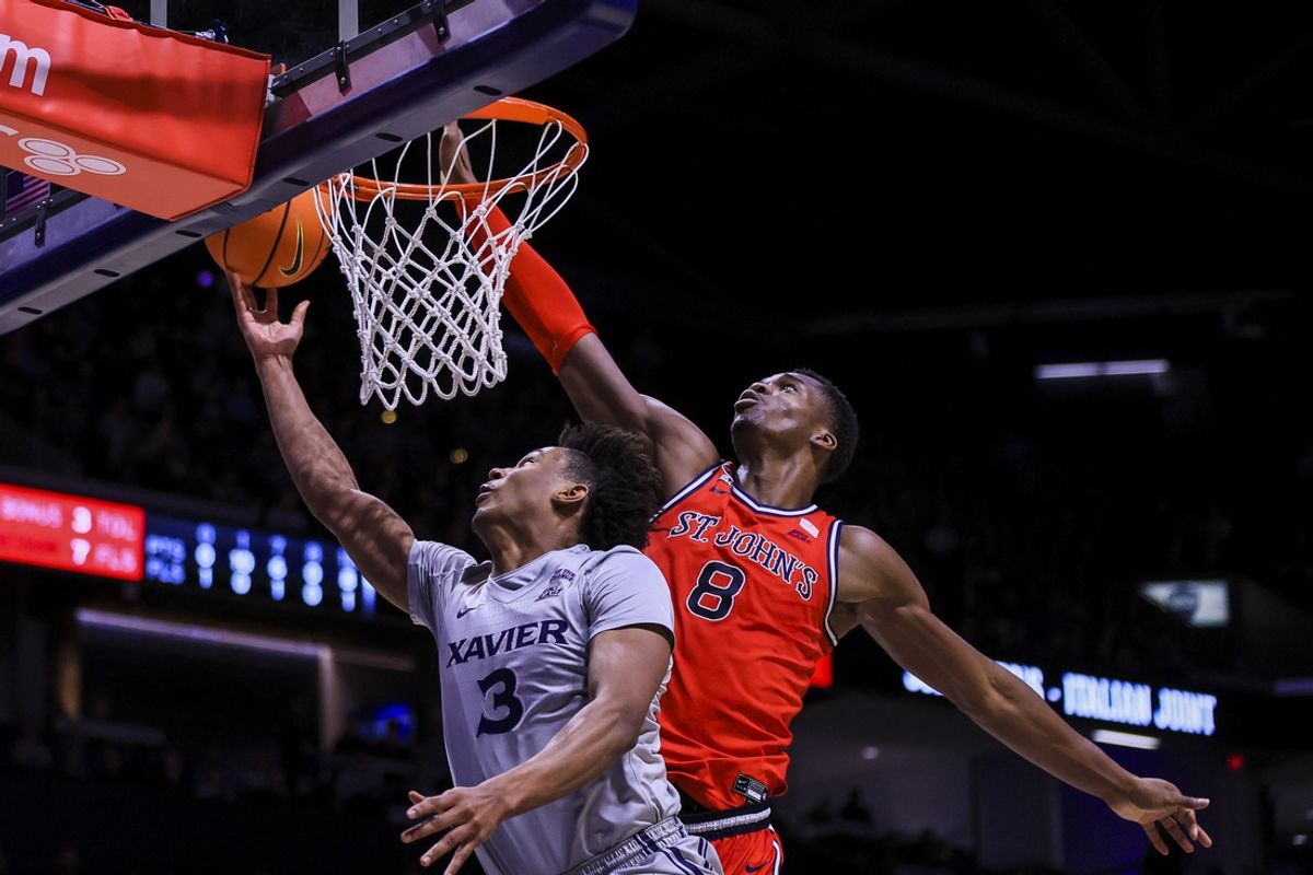 Jan 7, 2025; Cincinnati, Ohio, USA; Xavier Musketeers guard Dailyn Swain (3) shoots against St. John's Red Storm center Vince Iwuchukwu (8) in the first half at Cintas Center. Mandatory Credit: Katie Stratman-Imagn Images