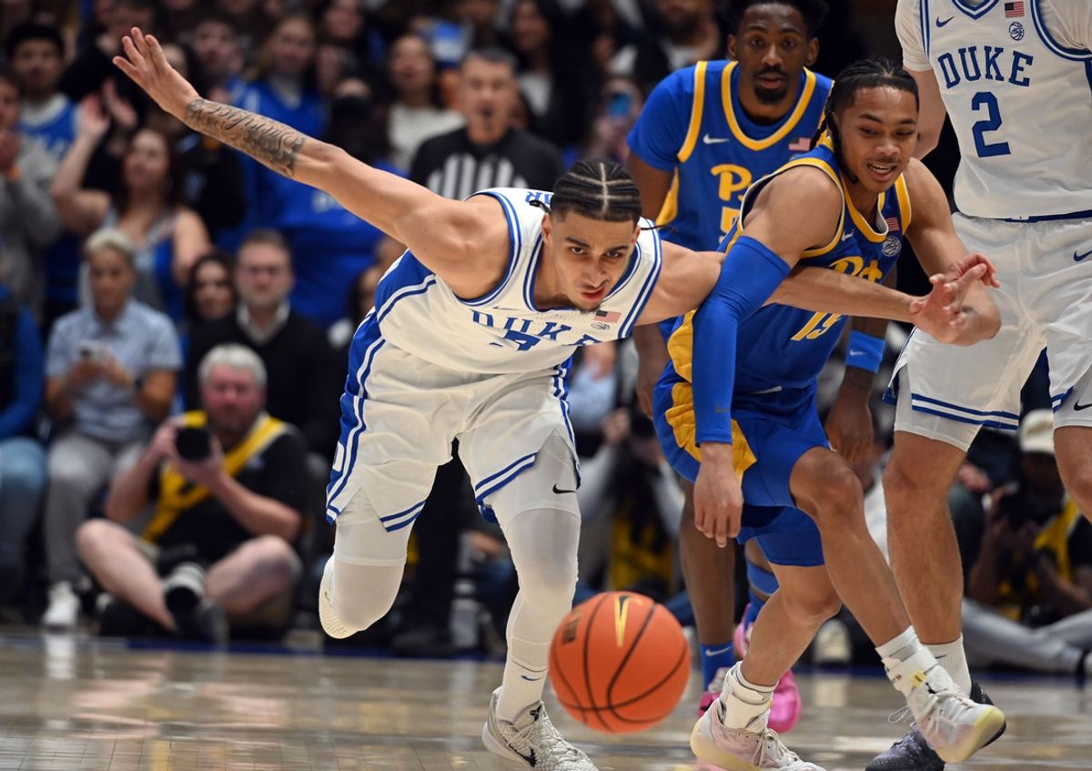 Jan 7, 2025; Durham, North Carolina, USA; Duke Blue Devils guard Tyrese Proctor (5) and Pittsburgh Panthers guard Jaland Lowe (15) battle for a loose ball during the first half at Cameron Indoor Stadium. Mandatory Credit: Rob Kinnan-Imagn Images