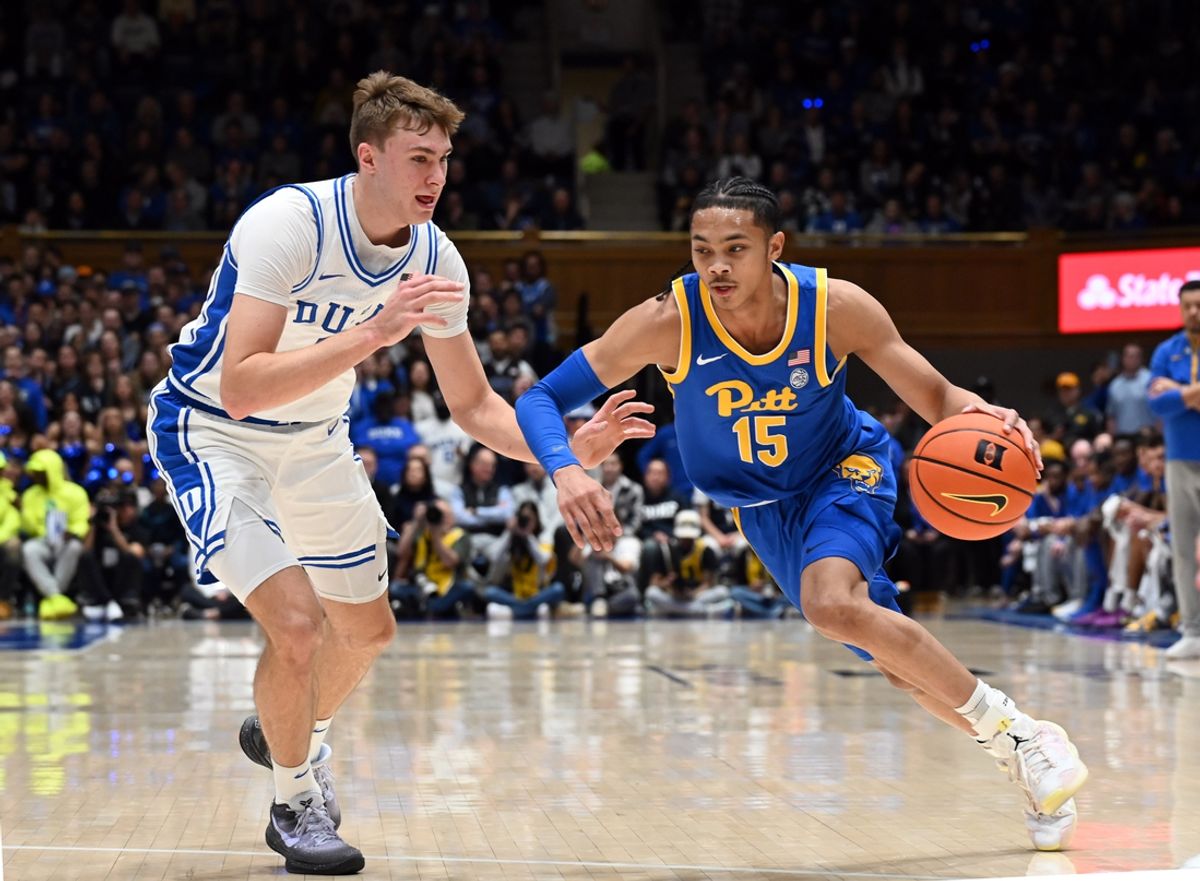 Jan 7, 2025; Durham, North Carolina, USA; Pittsburgh Panthers guard Jaland Lowe (15) drives to the basket as Duke Blue Devils forward Cooper Flagg (2) defends during the first half at Cameron Indoor Stadium. Mandatory Credit: Rob Kinnan-Imagn Images