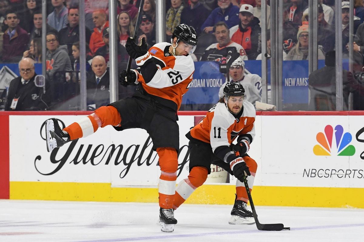 Jan 7, 2025; Philadelphia, Pennsylvania, USA; Philadelphia Flyers right wing Travis Konecny (11) pushes the puck into zone with center Ryan Poehling (25) against the Toronto Maple Leafs during the first period at Wells Fargo Center. Mandatory Credit: Eric Hartline-Imagn Images