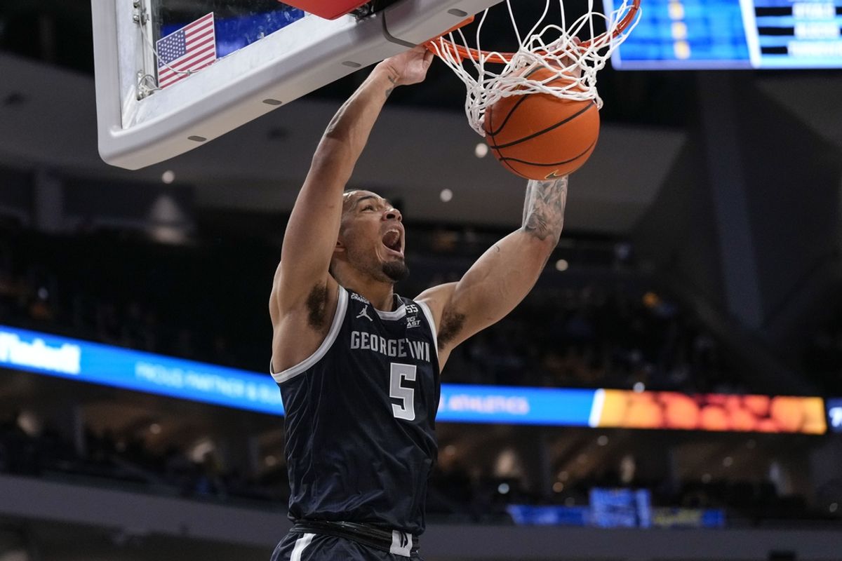 Jan 7, 2025; Milwaukee, Wisconsin, USA;  Georgetown Hoyas guard-forward Micah Peavy (5) dunks during the first half against the Marquette Golden Eagles at Fiserv Forum. Mandatory Credit: Jeff Hanisch-Imagn Images