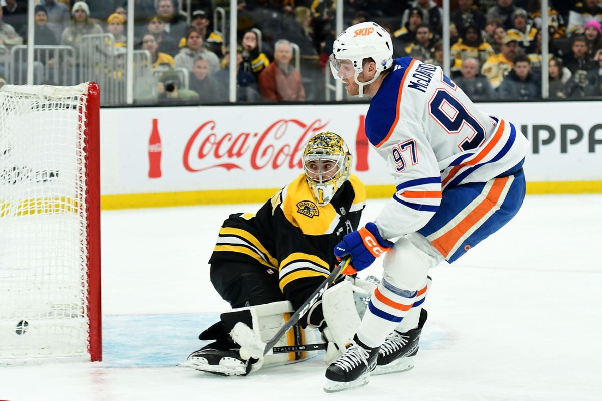 Jan 7, 2025; Boston, Massachusetts, USA;  Edmonton Oilers center Connor McDavid (97) scores a goal past Boston Bruins goaltender Jeremy Swayman (1) during the second period at TD Garden. Mandatory Credit: Bob DeChiara-Imagn Images