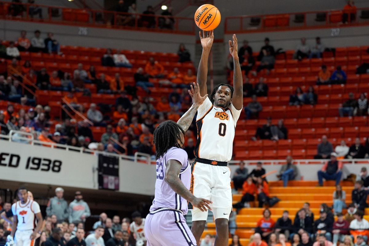 Oklahoma State Cowboys forward Marchelus Avery (0) makes a 3-pointer over Kansas State Wildcats guard Coleman Hawkins (33) during a men's BIG 12 basketball game between the Oklahoma State University Cowboys (OSU) and the Kansas State Wildcats at Gallagher-Iba Arena in Stillwater, Okla., Tuesday, Jan. 7, 2025.