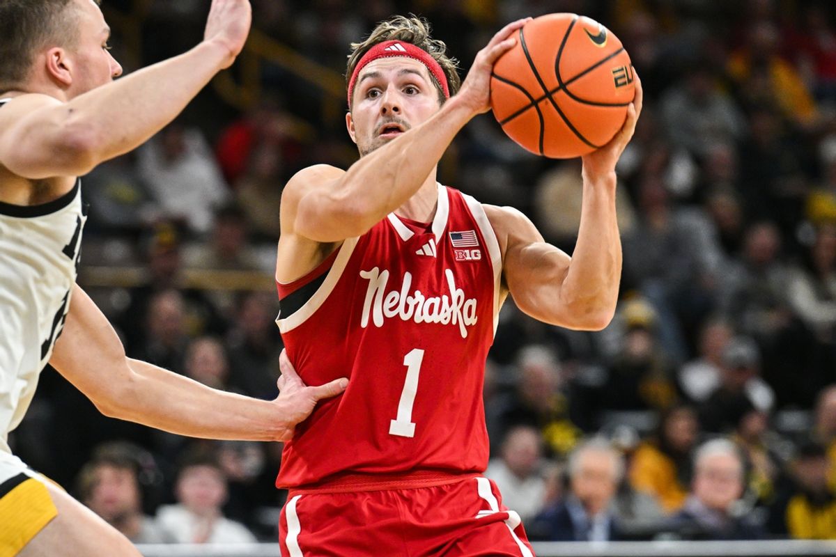 Jan 7, 2025; Iowa City, Iowa, USA; Nebraska Cornhuskers guard Sam Hoiberg (1) controls the ball as Iowa Hawkeyes guard Carter Kingsbury (14) defends during the first half at Carver-Hawkeye Arena. Mandatory Credit: Jeffrey Becker-Imagn Images