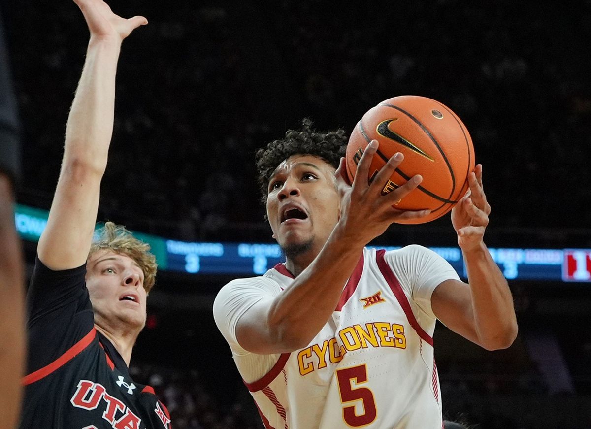 Iowa State Cyclones guard Curtis Jones (5) shoots the ball around Utah Utes forward Zach Keller (32) during the first half in the Big-12NCAA men’s basketball at Hilton Coliseum on Jan. 7, 2025 in Ames, Iowa.