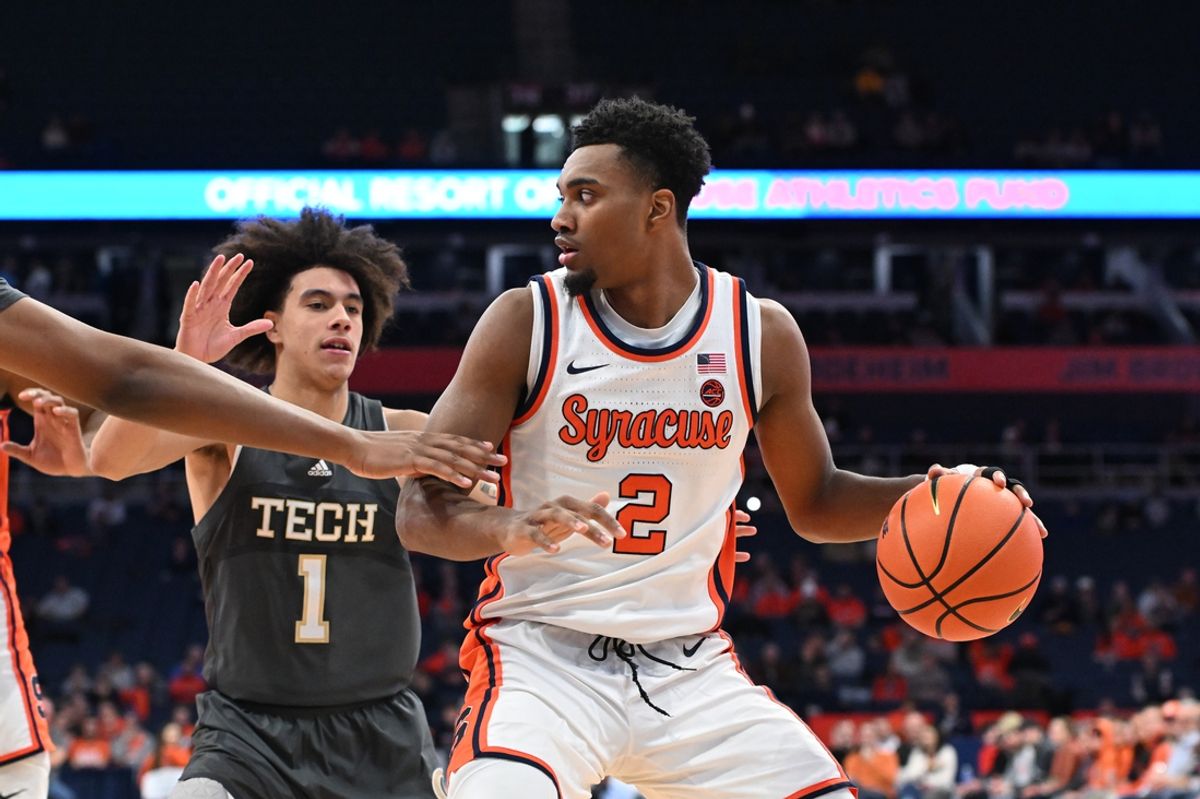 Jan 7, 2025; Syracuse, New York, USA; Syracuse Orange guard J.J. Starling (2) tries to get the ball past Georgia Tech Yellow Jackets guard Naithan George (1) in the second half at the JMA Wireless Dome. Mandatory Credit: Mark Konezny-Imagn Images