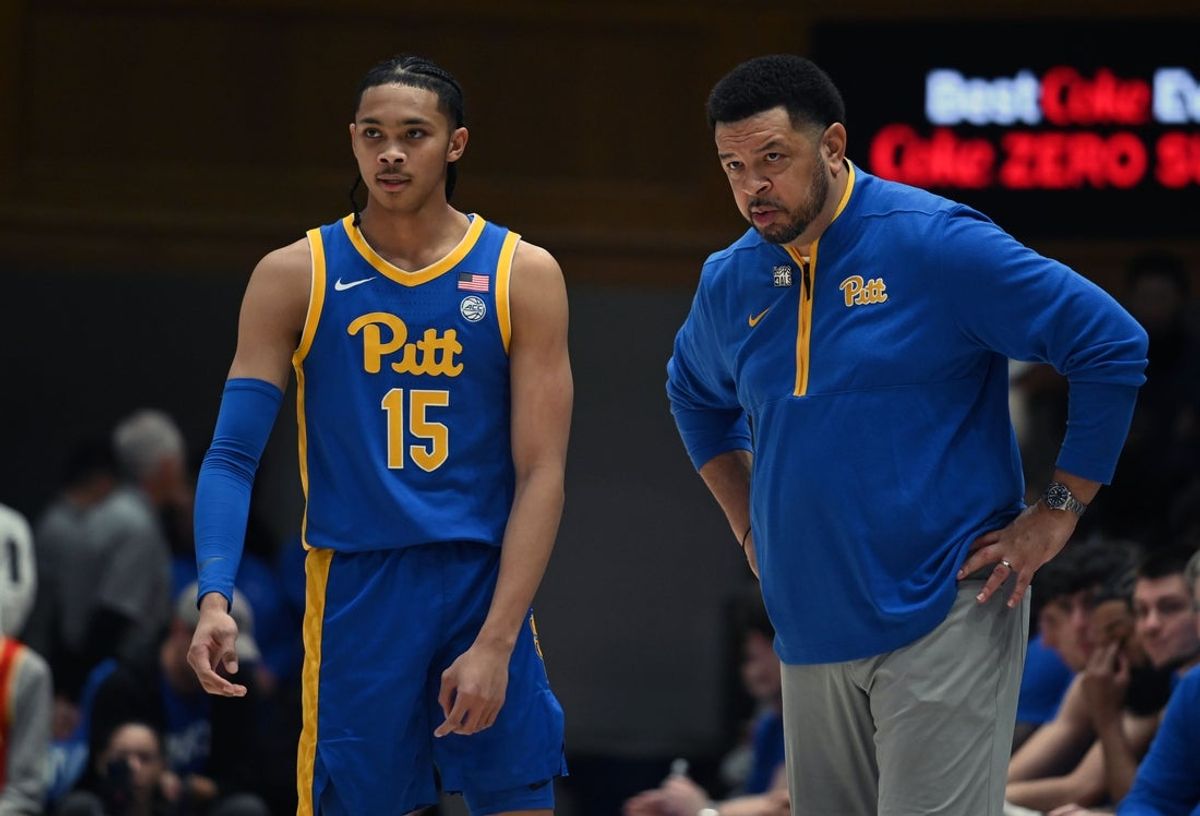 Jan 7, 2025; Durham, North Carolina, USA; Pitt Panthers head coach Jeff Capel (right) talks to guard Jaland Lowe (15) during the first half against the Duke Blue Devils at Cameron Indoor Stadium. Mandatory Credit: Rob Kinnan-Imagn Images