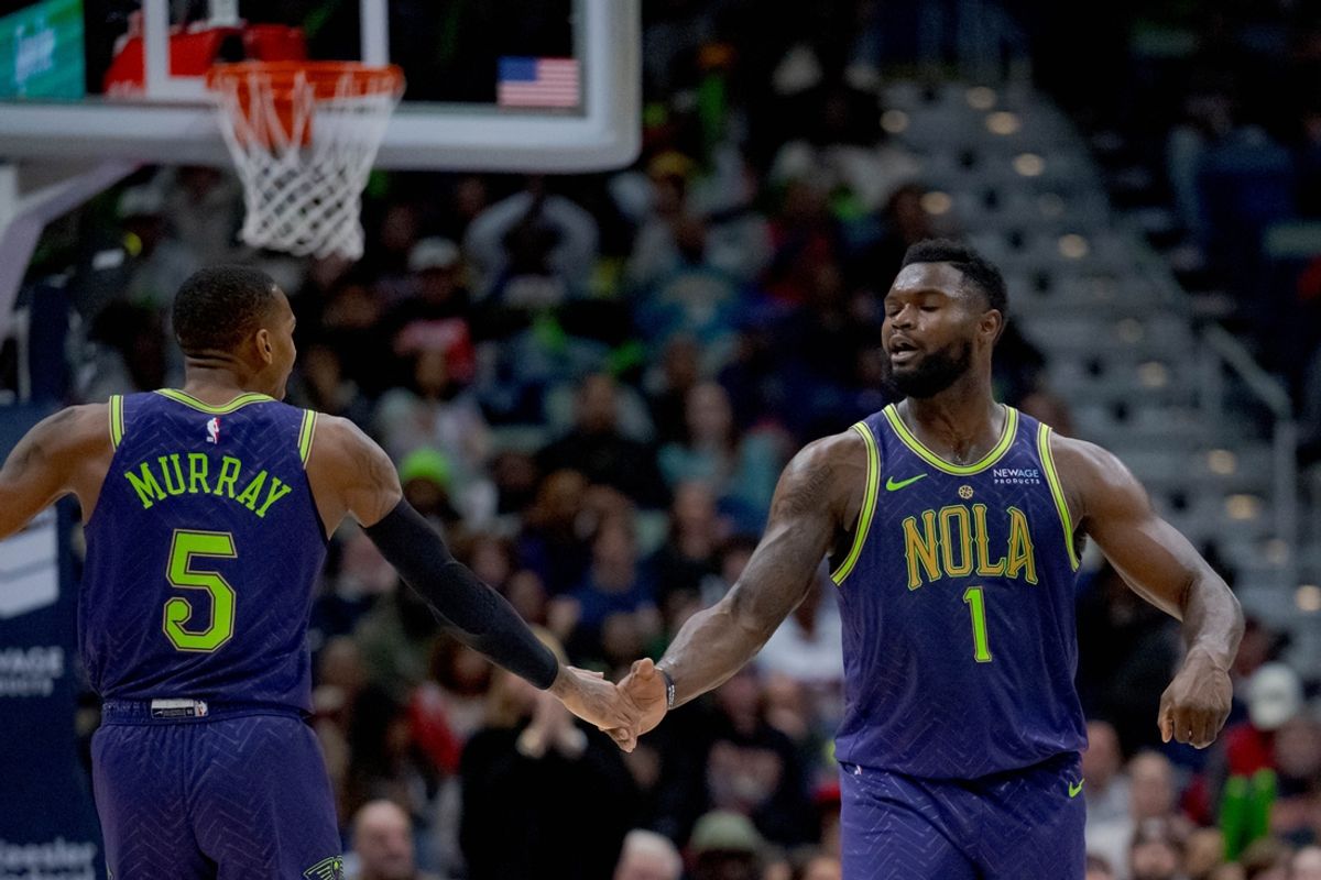 Jan 7, 2025; New Orleans, Louisiana, USA; New Orleans Pelicans guard Dejounte Murray (5) and New Orleans Pelicans forward Zion Williamson (1) celebrate a three-point basket made by Murray with an assist from Williamson during the first half against the Minnesota Timberwolves at Smoothie King Center. Mandatory Credit: Matthew Hinton-Imagn Images